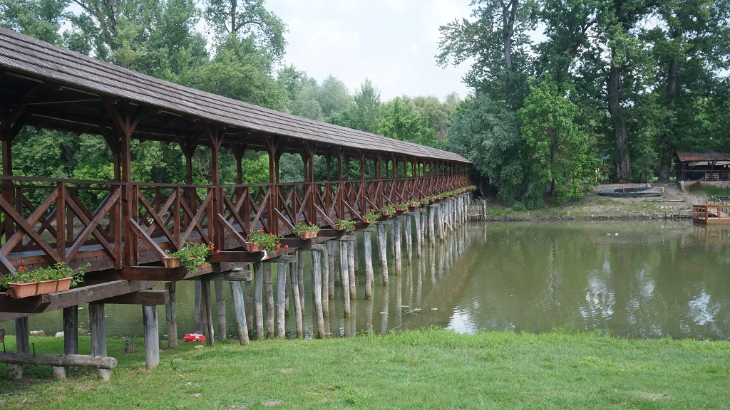 Wooden bridge over the river Small Danube in Kolárovo town. shutterstock.com Dusan UHRIN